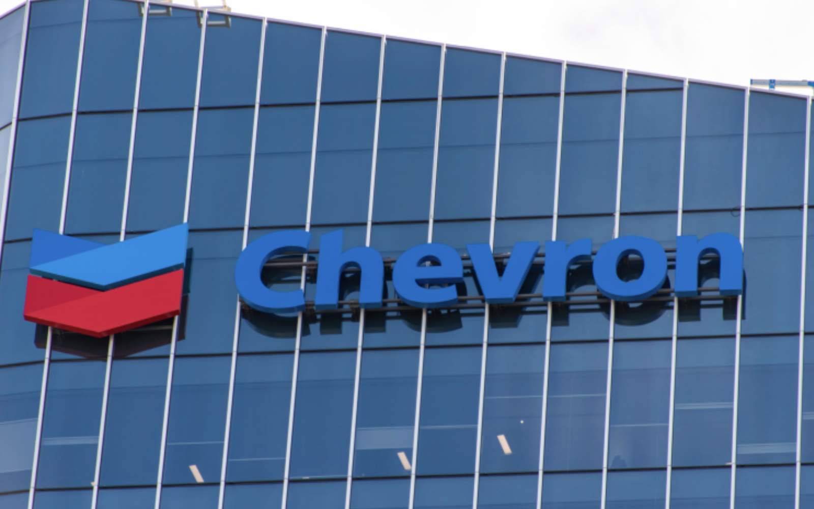 Oil rig or energy facility with Chevron logo, representing deep dive into Chevron stock analysis and investment strategy